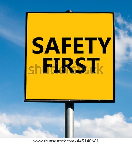 Safety first word on road sign on sky background