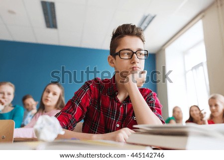 education, bullying, social relations and people concept - classmates gossiping behind student boy back at school Royalty-Free Stock Photo #445142746