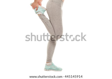 Fitness woman is stretching before jogging. Fitness and lifestyle concept. Gym workout 