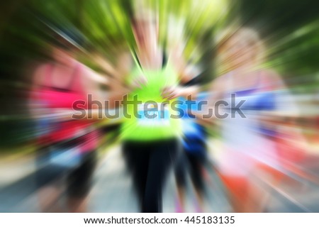 Blurry runners woman in marathon for background