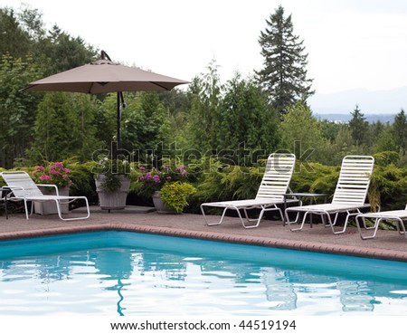 Poolside furniture with a view of the mountains