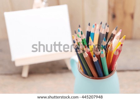 Colored pencils on wooden background,with space for text, Concept of education.
