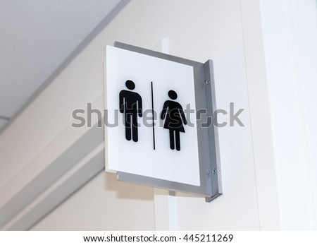 Men and women sign for bathroom