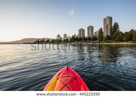 Paddle Boarding around False Creek in Downtown Vancouver, British Columbia (BC), Canada, during a sunny sunset.