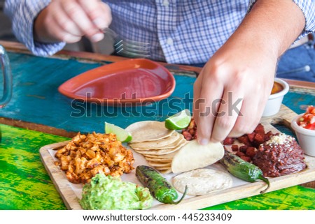 Mexican tacos with meat, beans and salsa. Top view
