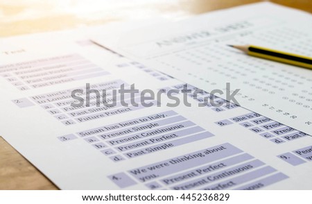 english exercise and answer sheet on table represent testing english grammar with gradient light Royalty-Free Stock Photo #445236829