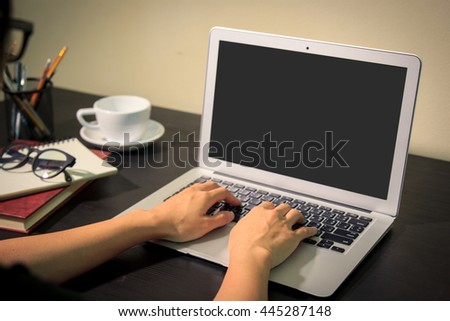 Hand typing on laptop 