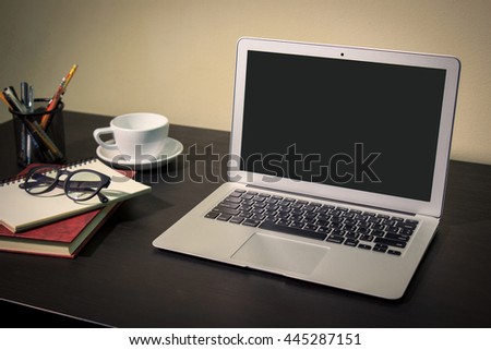 laptop on black table