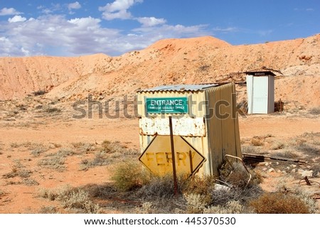 Direction sign to the geology office, ferry boat and ladies restroom in abandoned  desert ghost town of mining area, South Australia