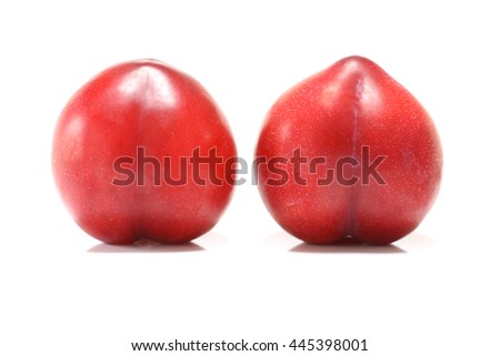 fresh red plum fruit in white