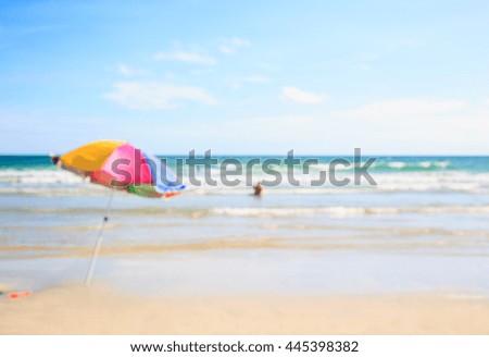 Blurred beach and umbrella