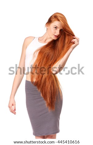 Beauty Girl Portrait. Healthy Long Red Hair. Beautiful Young Woman isolated on a white background