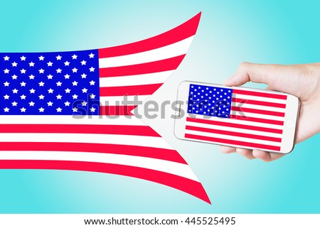 Man hand holding mobile smart phone with United States flag