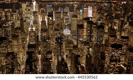 illuminated new york city skyline at night background. dramatic aerial shot of urban metropolis scenery  