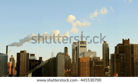 new york city skyline cityscape background. industrial smoke pollution raising over urban landmarks