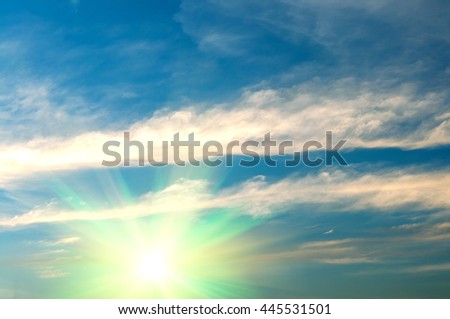 Abstract background of blue sky and white clouds with the sun shining