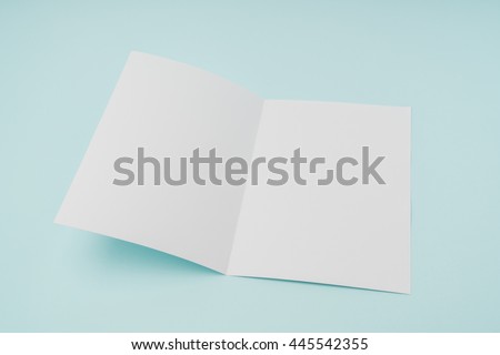 Bifold white template paper on blue background