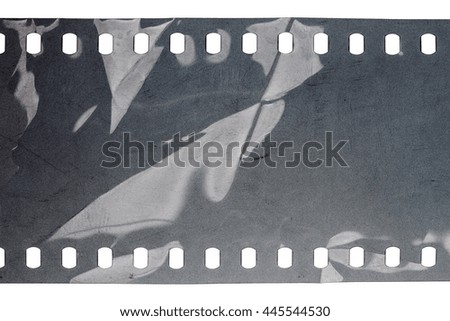 Blank crumpled noisy gray filmstrip isolated on white background