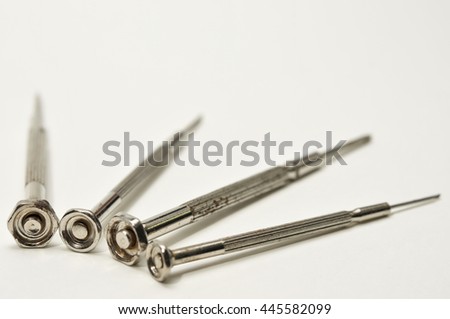 old screw drivers polished and rush on white background, need to show depth of field