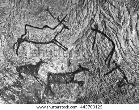 Abstract children art in cave. Black carbon paint of human hunting on sandstone wall, copy of prehistoric picture.Prehistoric drawings in cave. Bison, mammoth, deer, caveman. Primitive neanderthal art