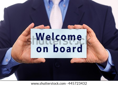 Business man hold paper with "welcome on board" text on it