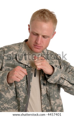 A soldier tearing his dog tags