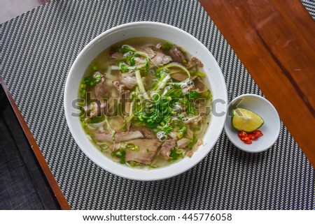 rice noodle soup with sliced beef Royalty-Free Stock Photo #445776058