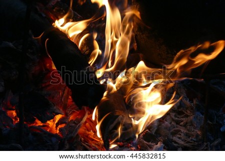 Flame from a charcoal spot to be used for cooking.