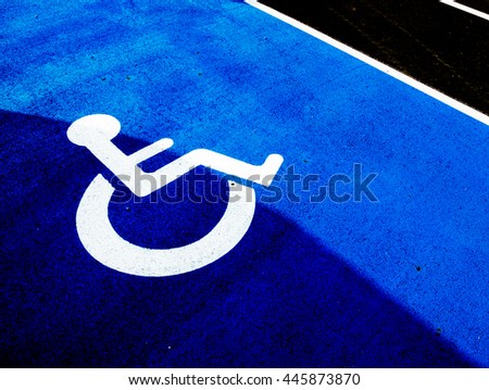 Safety parking space for disabled person on the ground tar