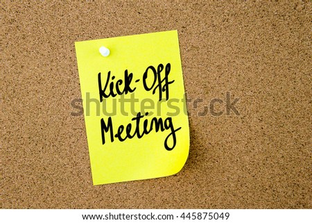 Kick-Off Meeting written on yellow paper note pinned on cork board with white thumbtacks, copy space available Royalty-Free Stock Photo #445875049