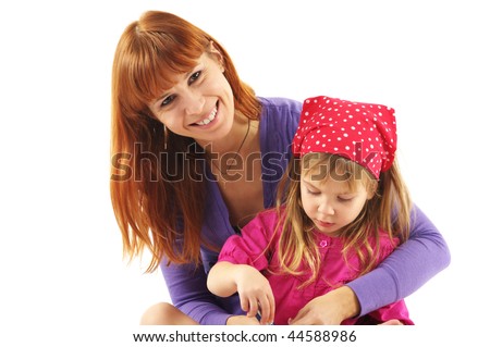 Happy mother and daughter looking in camera on white background.