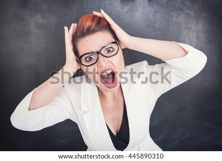 Angry screaming teacher on chalkboard blackboard background