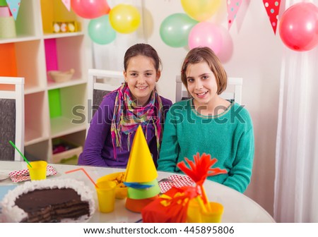 Two girls having fun on birthday party