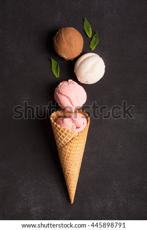 Waffle with ice cream on a black chalkboard (top view) Royalty-Free Stock Photo #445898791