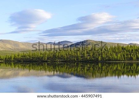 Evening on mountain lake in the summer