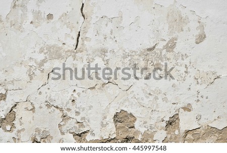 Background texture of old dirty white painted plaster wall with cracks, gaps and grunge stains 