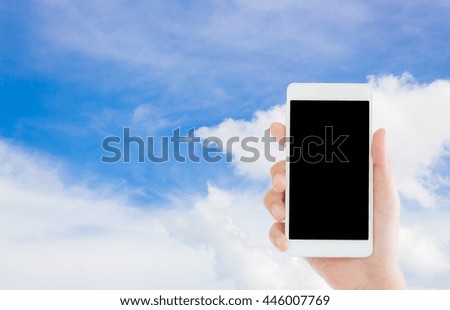 woman use mobile phone and blue sky and white cloud for background