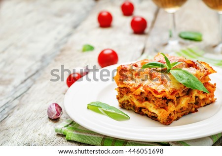 Meat lasagna on a white wood background. toning. selective focus Royalty-Free Stock Photo #446051698