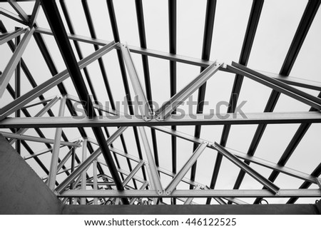 Black and white photo,Structure of steel roof frame for construction.