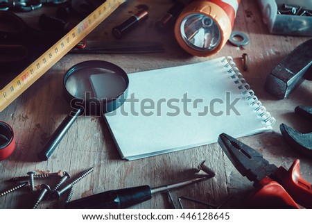 Workbench with notebook and pencil