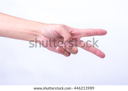 raising two fingers up on hand it is shows peace strength fight or victory symbol and letter V in sign language on white background.