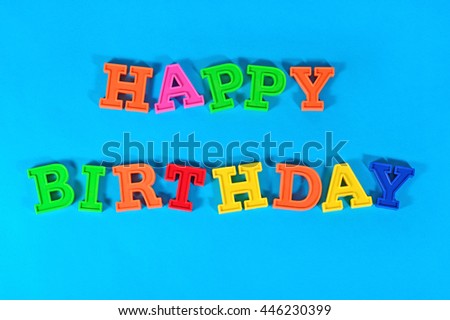 Happy birthday colorful text on a blue background 