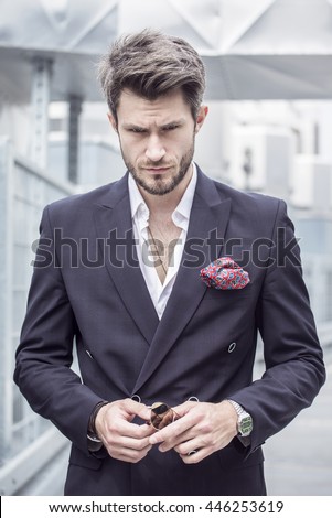 Portrait of a man in the jacket on a city background