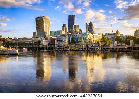 London cityscape during sunrise with its reflection from river Thames.