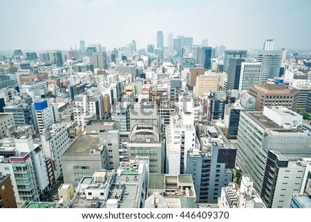 Business concept - panoramic modern city skyline bird eye aerial view with spiral tower and midland square under dramatic cloud and morning bright blue sky on Nagoya TV Tower in Nagoya, Japan