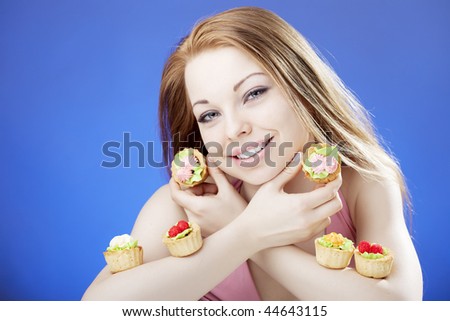 Images of a beautiful girl who eats cakes