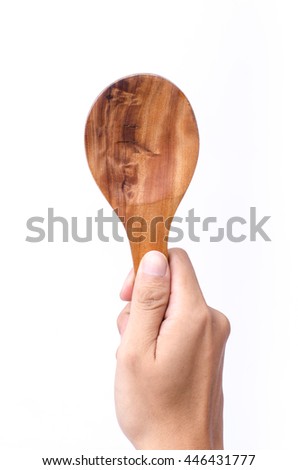 hand holding Wooden Spoon isolated on white.