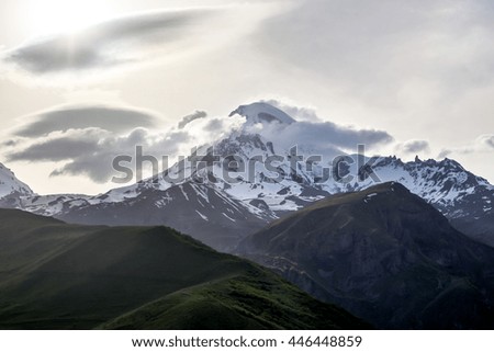 Snow peak of Mount Kazbek in the evening. Georgia.