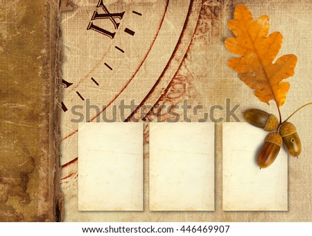 Old vintage album with autumn oak leaves and acorns