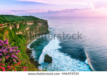 View of Uluwatu cliff with pavilion and blue sea in Bali, Indonesia Royalty-Free Stock Photo #446493934